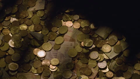 Coins and banknotes given as donations in a church. Stockbeeldmateriaal 315401237