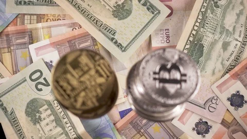 Coins and bitcoins fall down on cash top view slow motion Stock Footage 85642264