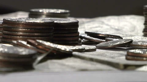 Coins and Currency Rotating on a Turntable Video stock 35775083