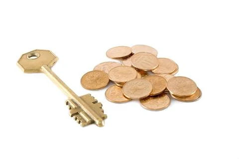 Coins and a key Stock Photos