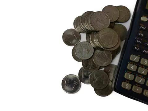 Coins and notes counting or calculation by calculator on white background 스톡 사진