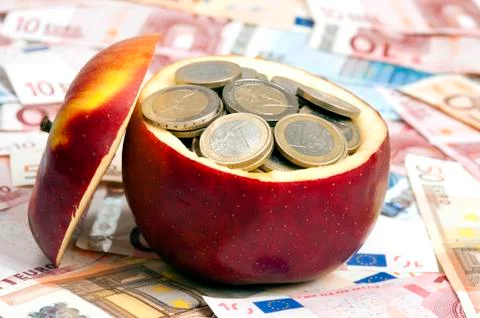 Coins on apple Foto stock