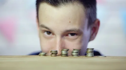 The coins are on the table stacked in a tower. Close up Stock Footage 109159802