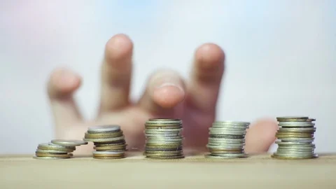 The coins are on the table stacked in a tower. Close up Stock Footage 111962648