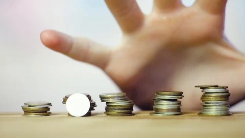The coins are on the table stacked in a tower. Close up Stock Footage 113599490
