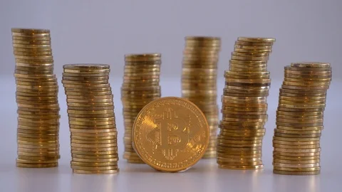 Coins around bitcoin on white background with blink effect Stock Footage 119127599