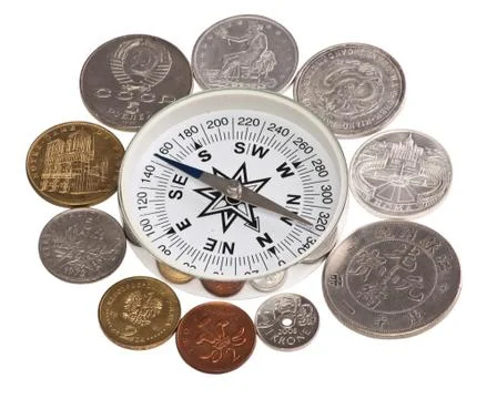 Coins around the compass Stock Photos