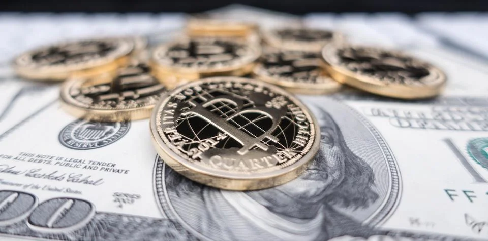 Coins of bitcoin on dollar notes Stock Photos