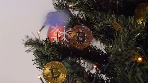 Coins of Bitcoin Payment System Hang on Christmas Tree Closeup Stock Footage 83692116