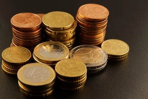 Coins on a black background Stock Photos