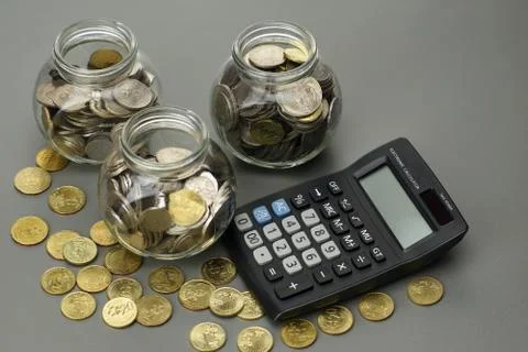 Coins with calculator. financial concept Stock Photos