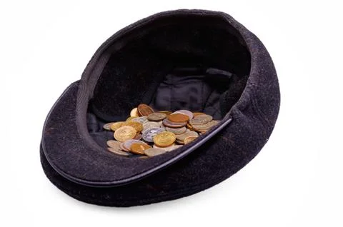 Coins in a cap Stock Photos