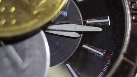Coins on the clock or time is money. Stock Footage 70695095
