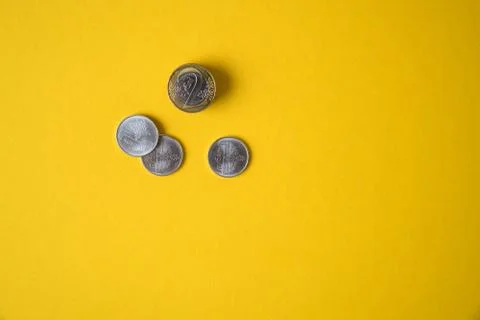 Coins close-up on a yellow background Stock Photos