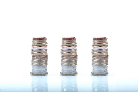 Coins currency stack with reflection Stock Photos