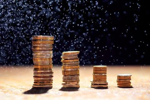 Coins on a dark background. - Image Stock Photos