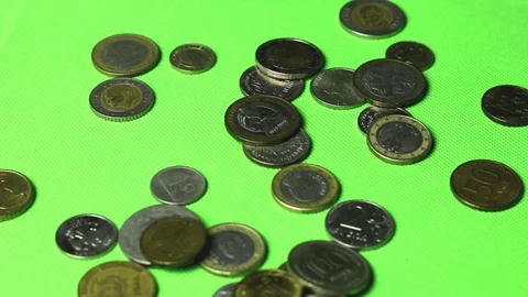 Coins of different countries are falling on the green screen. Stock Footage 119875536