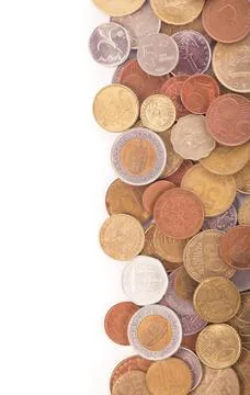 Coins of different countries on a white background. Stock Photos