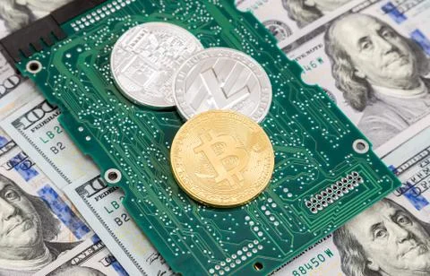 Coins of digital cryptocurrency, electronic computer component and american d Stock Photos