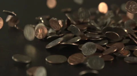 Coins drop on to a table - slow motion. Stock Footage 44104782