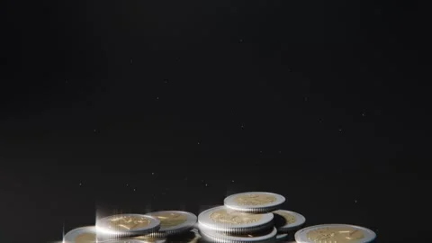 Coins dropping from above, flipping and colliding on black surface in studio, Stock Footage 337885997