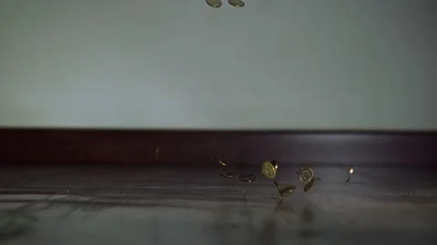 COINS DROPPING SLOW MOTION Video stock 231779346