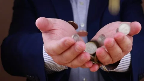 Coins fall on a man's hand Video stock 155983257
