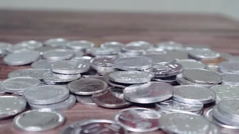 Coins fall into the pile of coins Stock Footage 256683615