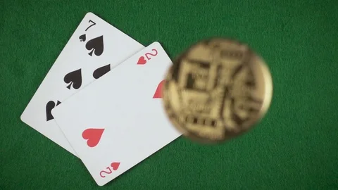 Coins fall on the seven and the deuce top view slow mo Video stock 85642216