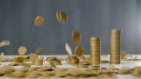 Coins fall on the table in slow motion Stock Footage 107182930