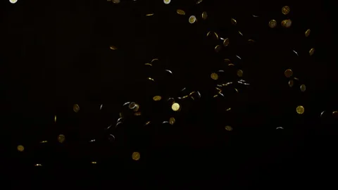 Coins falling on a black background, Ultra Slow Motion Video stock 86580059