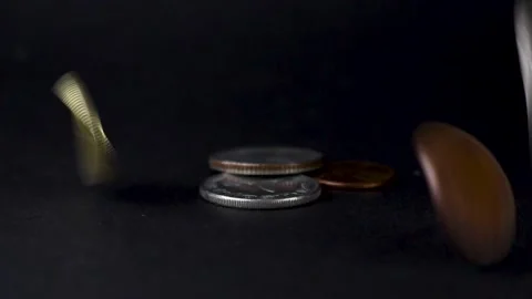 Coins falling on black ground Stock Footage 137164775