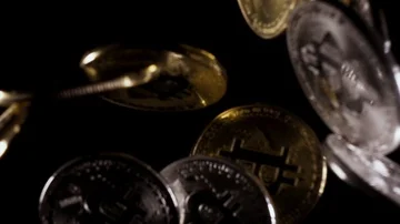 Coins falling down on a black background slow motion Stock Footage 85472608