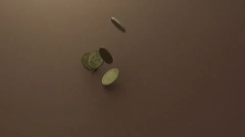 Coins falling onto a group of other coins Stock Footage 55291405