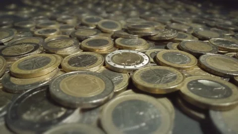 Coins falling into other coins Video stock 220684594
