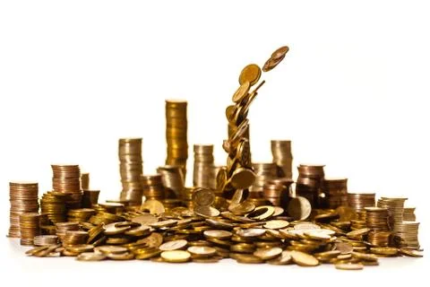Coins falling into a pile Stock Photos