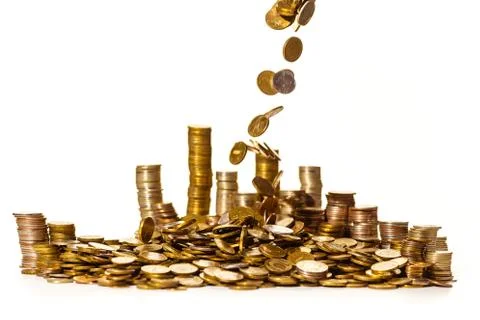 Coins falling into a pile 스톡 사진