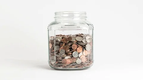 Coins Fill Up Jar Stop Motion Time-lapse Video stock 74959238
