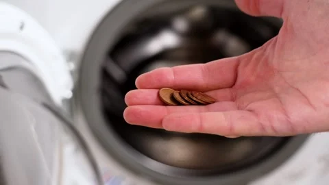 Coins found from the drum of a washing machine Stock Footage 264271674
