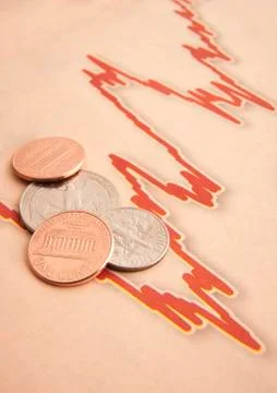 Coins on graph paper Foto stock