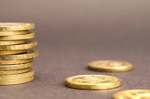 Coins on a gray background Stock Photos