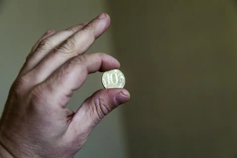 Coins in a hand Stock Photos