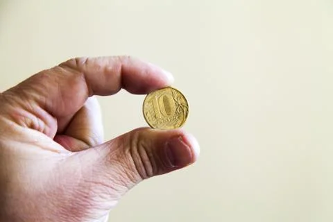 Coins in a hand Stock Photos