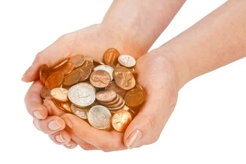Coins in hands over plain background Foto stock