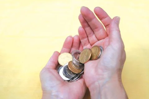 Coins in Hands Foto stock