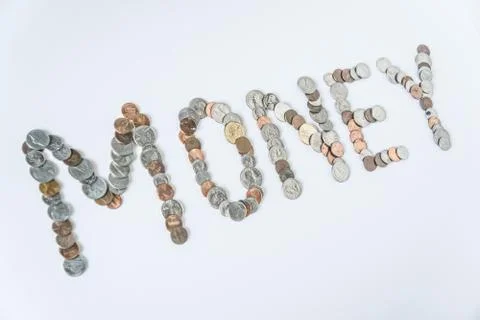 Coins isolated on solid white background spelling the word Money Stock Photos