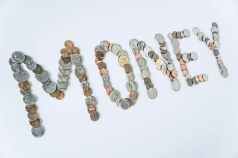 Coins isolated on solid white background spelling the word Money Stock Photos