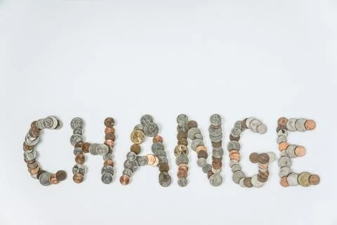 Coins isolated on solid white background spelling the word Change Stock Photos