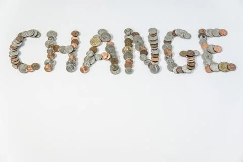 Coins isolated on solid white background spelling the word Change Stock Photos