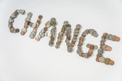 Coins isolated on solid white background spelling the word Change Stock Photos